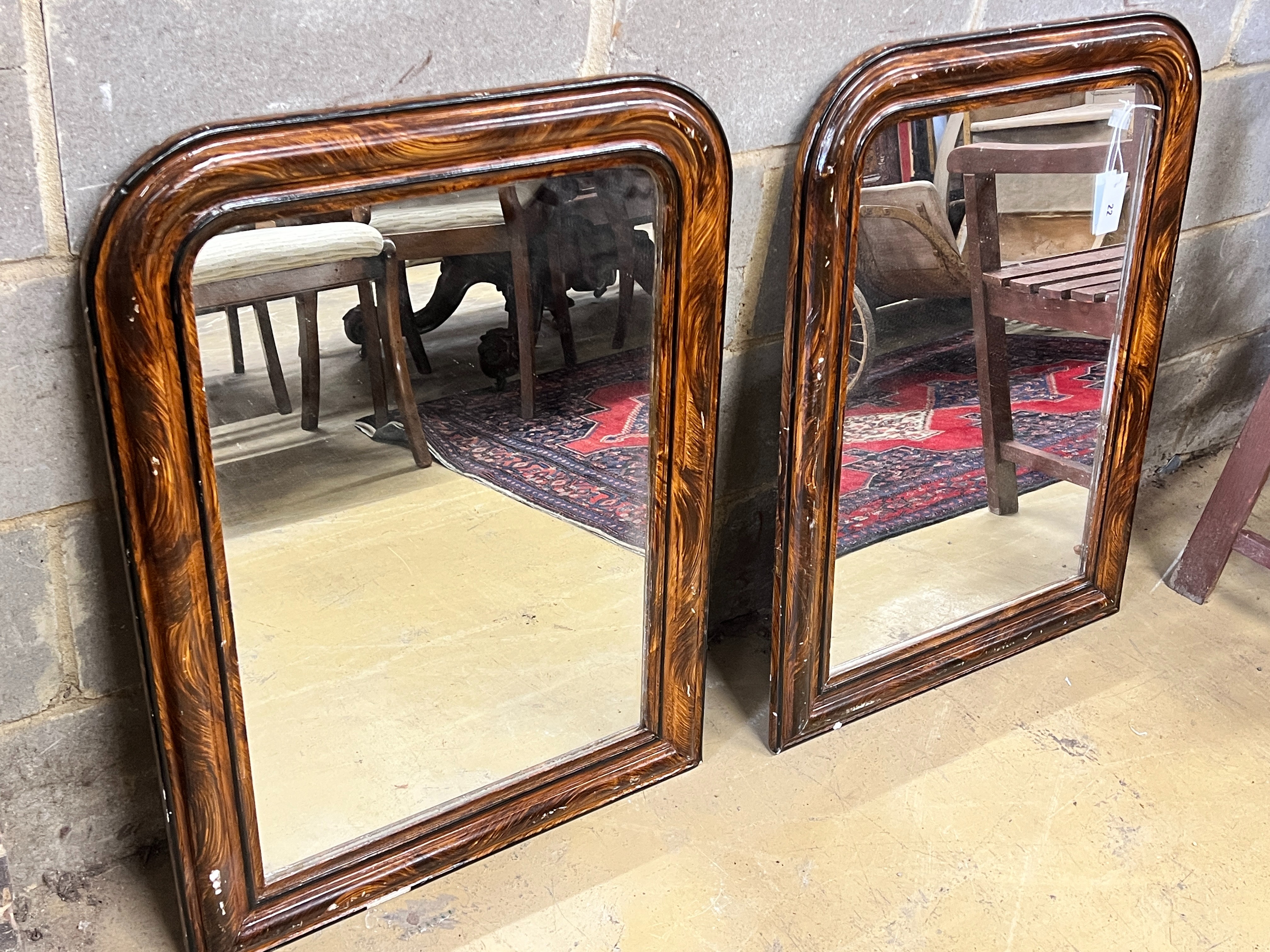 A pair of Victorian wall mirrors with painted simulated grain, width 60cm, height 81cm